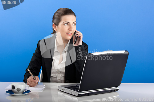 Image of Businesswoman calling at phone