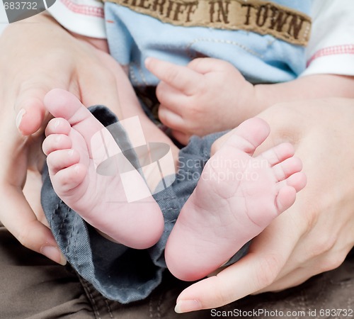 Image of Newborn child in caring hands