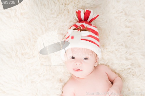 Image of Newborn baby in chritstmas hat