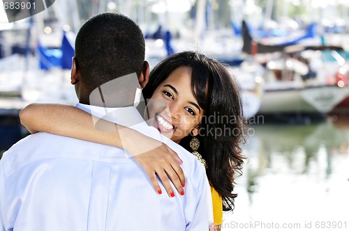 Image of Happy woman hugging man