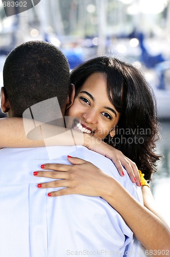 Image of Happy woman hugging man