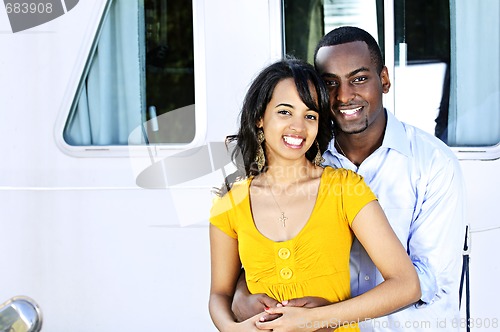 Image of Happy couple in front of yacht