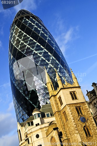 Image of Gherkin building and church of St. Andrew Undershaft in London