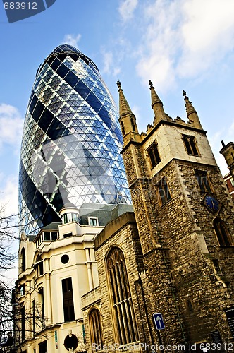 Image of Gherkin building and church of St. Andrew Undershaft in London