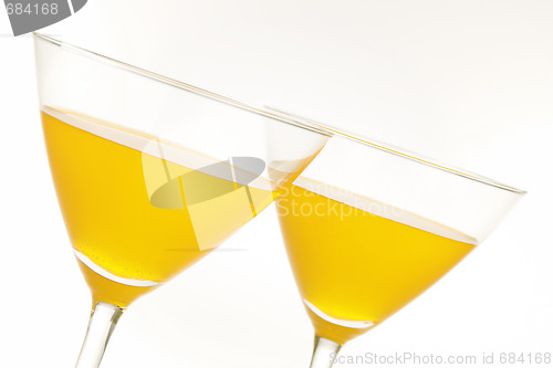 Image of Two yellow drinks