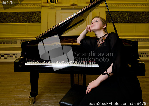 Image of Dreamy smiling pianist