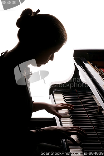 Image of girl playing the piano