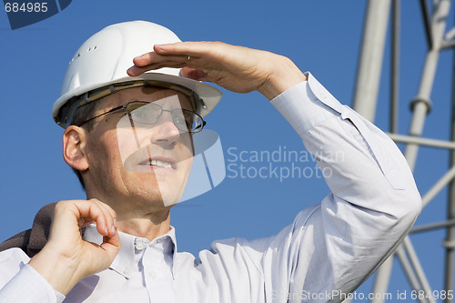 Image of Engineer in front of steel construction