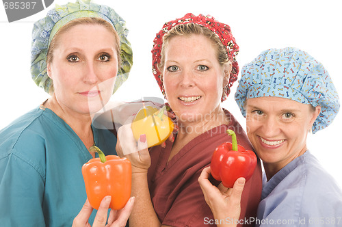 Image of group of nurses with healthy fruits and vegetables