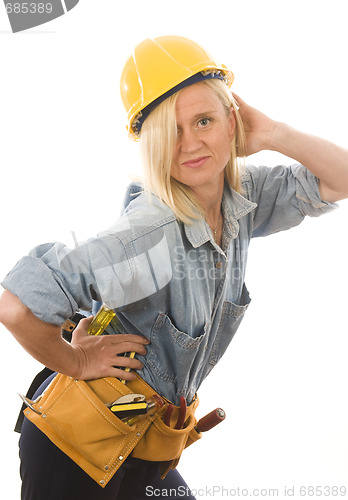 Image of attractive woman contractor with tools and hard hat helmet