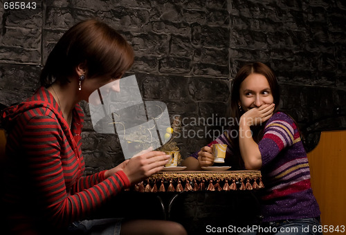 Image of Two friends in a restaurant