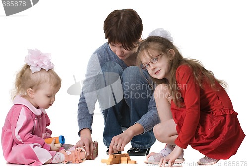 Image of mother plays with two daughters