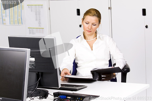 Image of beautiful young woman at the office
