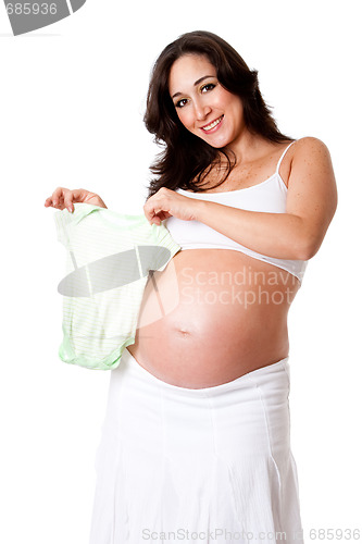 Image of Pregnant woman holding baby bodysuit