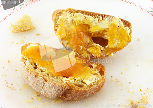 Image of Bread with butter and honey or marmalade