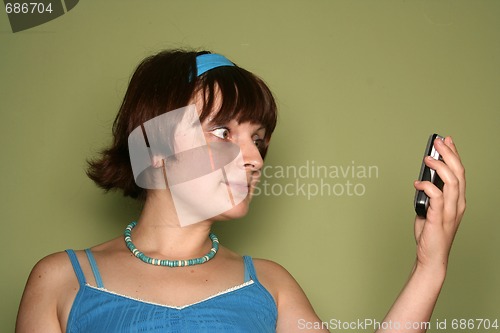 Image of young woman calling by cellular phone