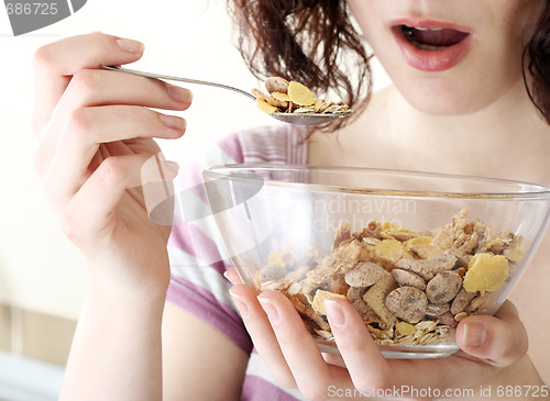 Image of Young people eating milk with cereals