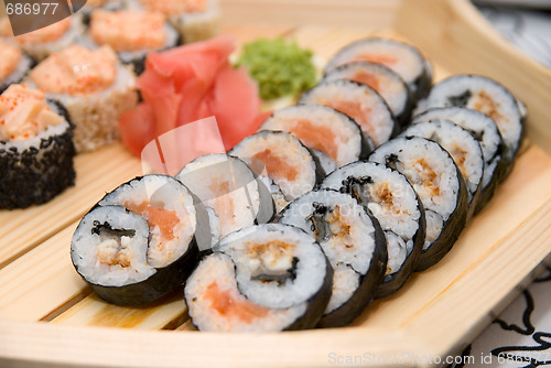 Image of Sushi on wood plate