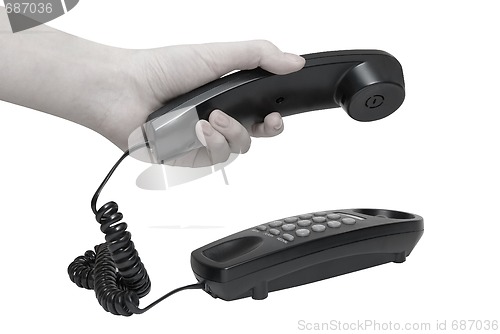 Image of telephone with hands dialing