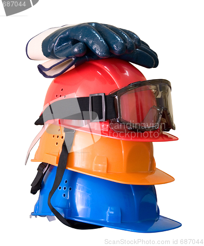 Image of Many colored hardhats, gloves and goggles