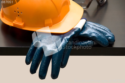 Image of Orange hardhat and  leather gloves 