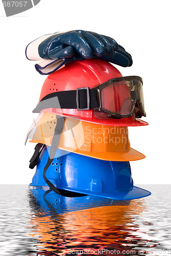 Image of Many colored hardhats, gloves and goggles