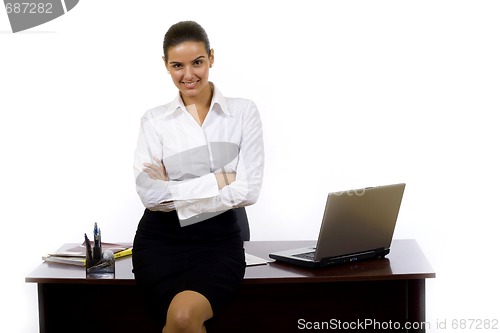 Image of businesswoman  against office desk