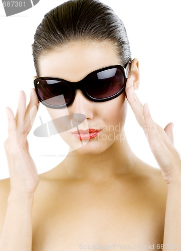 Image of young woman in big black fashion sunglasses