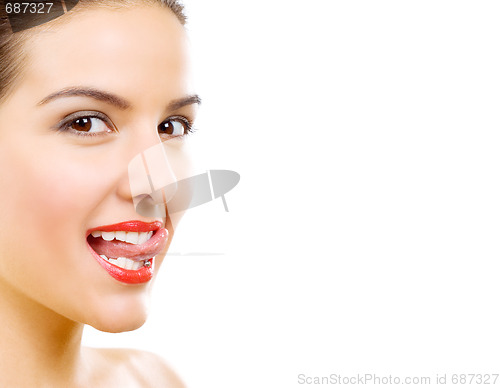 Image of beautiful woman who puts tongue out