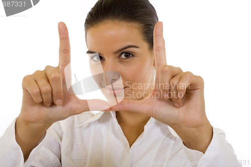 Image of young woman making a snapshot sign
