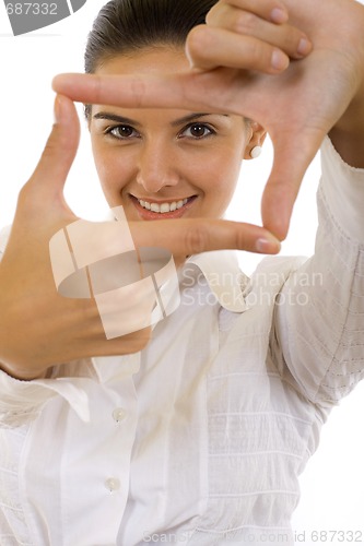 Image of A woman looking threw her fingers