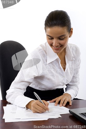 Image of Business Woman signing documents