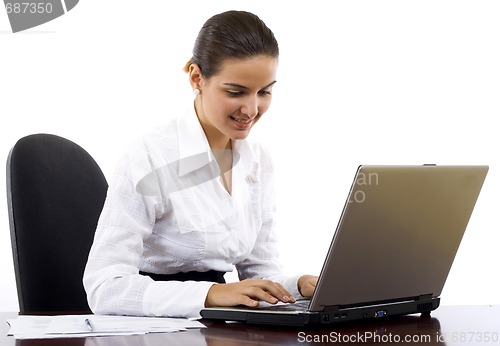 Image of businesswoman working on her laptop