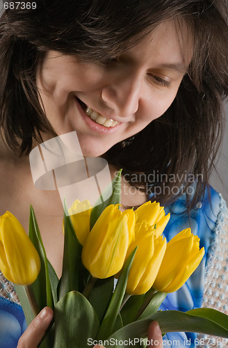 Image of beautiful woman with tulips