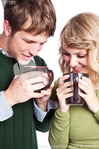 Image of Caucasian couple holding coffee cups