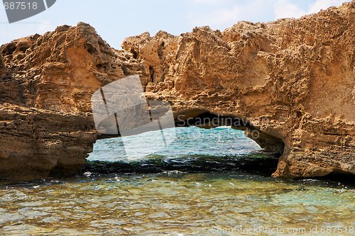 Image of Scenic arch rock in sea water 