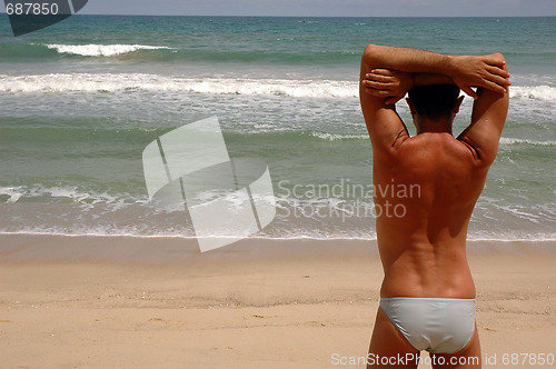 Image of MAN AT THE BEACH THINKING