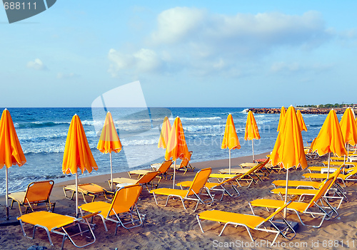 Image of Sunbeds and beach umbrellas