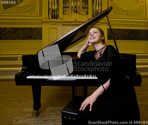 Image of Dreamy smiling pianist