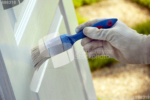 Image of Painting wooden door