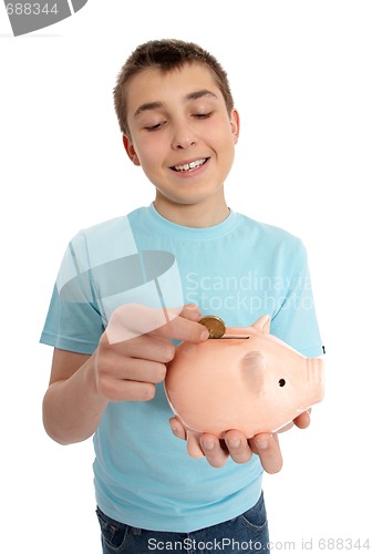 Image of Boy dropping coin into money box