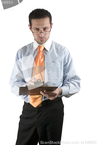 Image of Businessman looking over his glasses with clipboard on hand