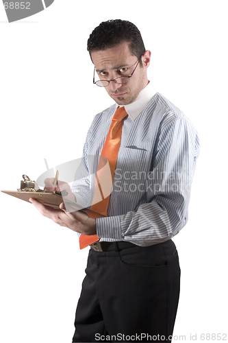 Image of Businessman looking over his glasses with clipboard on hand - fr