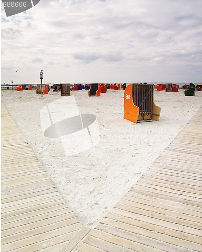 Image of roofed wicker beach chairs