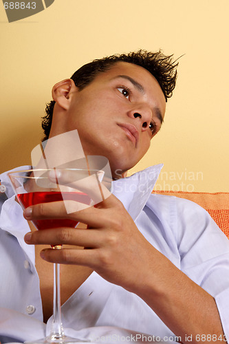 Image of Young male with red cocktail