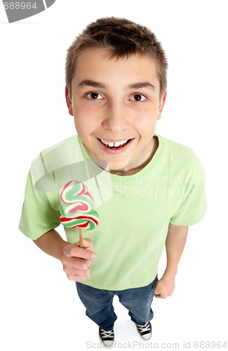 Image of Happy boy holding a lollipop candy
