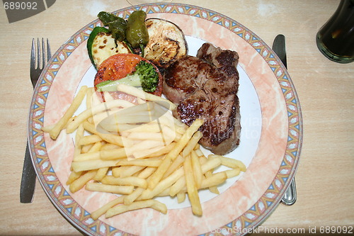 Image of Beef, chips and vegetables