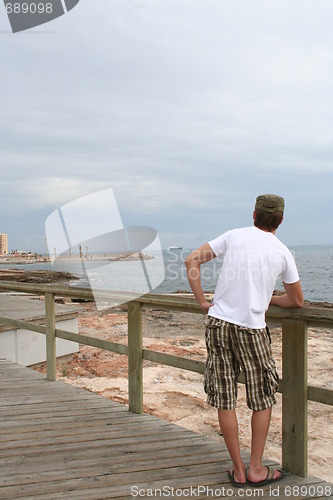 Image of Young man by the sea in Torrevieja