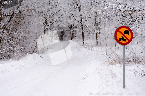 Image of Winter road with traffic sign