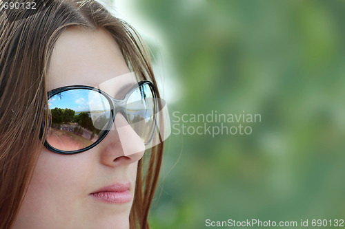 Image of The cute girl in sun glasses